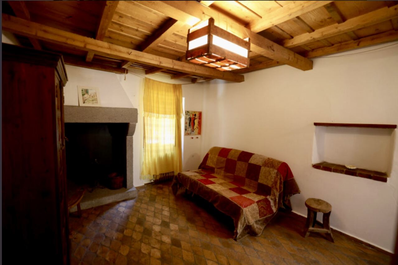Sitting room with the original stone hearth